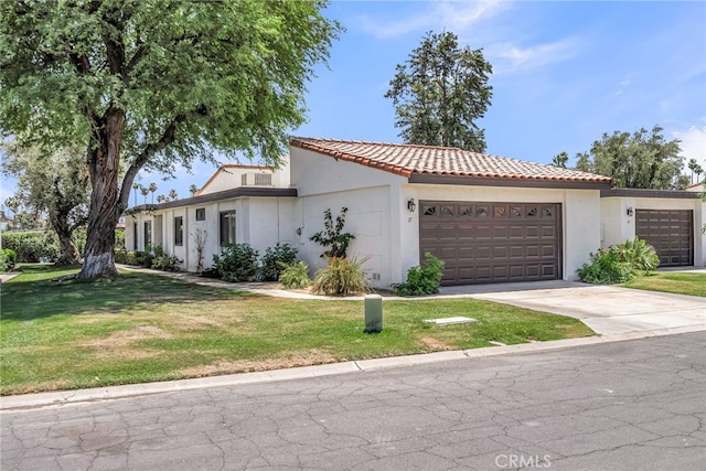 17 Toledo Dr, Rancho Mirage, CA 92270 - mediterranean / spanish home featuring a garage, a tile roof, stucco siding, and a front yard