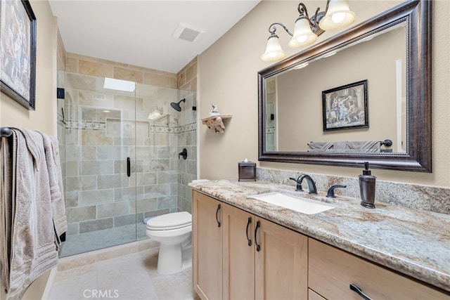 17 Toledo Dr, Rancho Mirage, CA 92270 - bathroom with vanity, toilet, a stall shower, and tile patterned flooring