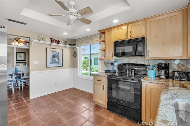 17 Toledo Dr, Rancho Mirage, CA 92270 - kitchen with black appliances, light brown cabinets, a ceiling fan, a raised ceiling, and decorative backsplash