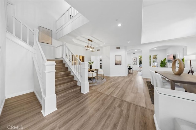 2517 Tequestra, Tustin, CA 92782 - entrance foyer featuring wood finished floors, stairs, arched walkways, recessed lighting, and baseboards