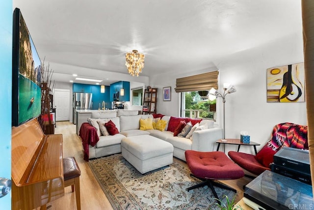 1738 33rd St, San Diego, CA 92102 - living area featuring light wood finished floors and a chandelier