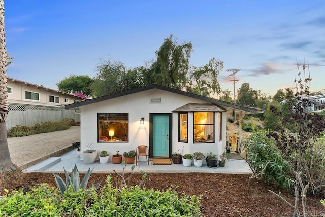 1738 33rd St, San Diego, CA 92102 - back of house at dusk featuring stucco siding
