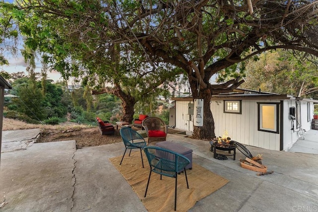 1738 33rd St, San Diego, CA 92102 - view of patio with a fire pit and an outbuilding