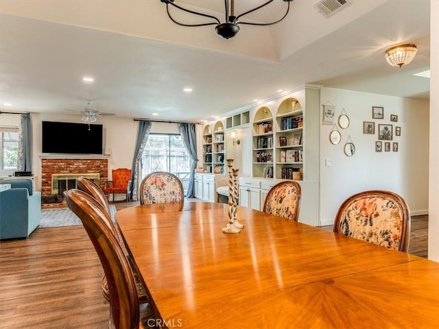 5435 Del Norte Way, Santa Maria, CA 93455 - dining space featuring healthy amount of natural light, a brick fireplace, wood finished floors, recessed lighting, and ceiling fan