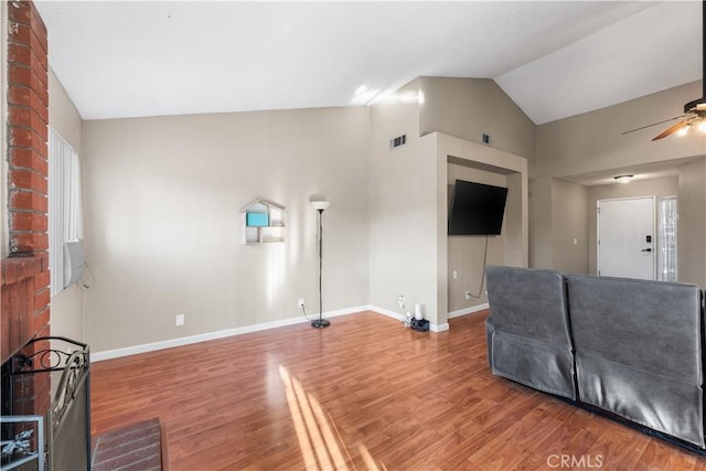 3611 Jupiter Ave, Palmdale, CA 93550 - unfurnished living room with vaulted ceiling, ceiling fan, baseboards, and wood finished floors