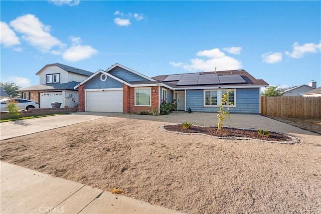 3611 Jupiter Ave, Palmdale, CA 93550 - single story home featuring driveway, roof mounted solar panels, a garage, and brick siding