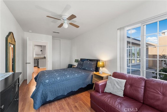 3611 Jupiter Ave, Palmdale, CA 93550 - bedroom with wood finished floors, a closet, and ceiling fan