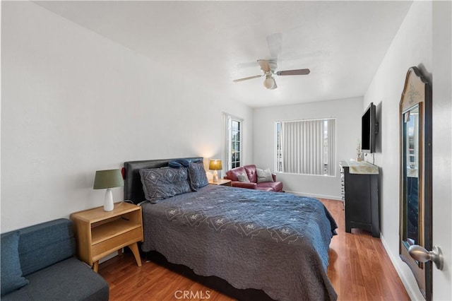 3611 Jupiter Ave, Palmdale, CA 93550 - bedroom featuring wood finished floors, a ceiling fan, and baseboards