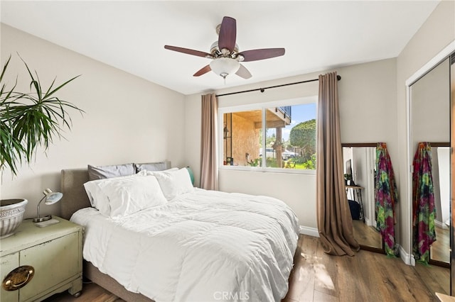 24311 Canyon Lake Dr N Unit 12, Canyon Lake, CA 92587 - bedroom featuring wood finished floors, baseboards, a ceiling fan, and a closet