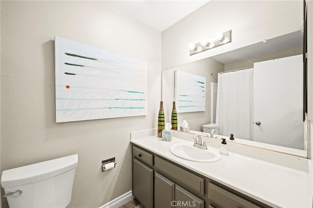 24311 Canyon Lake Dr N Unit 12, Canyon Lake, CA 92587 - bathroom featuring toilet, vanity, and baseboards