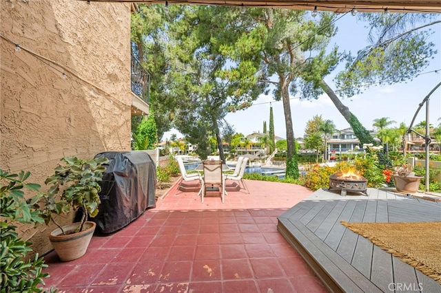 24311 Canyon Lake Dr N Unit 12, Canyon Lake, CA 92587 - view of patio / terrace featuring a fire pit and outdoor dining space