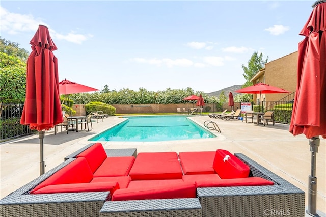 24311 Canyon Lake Dr N Unit 12, Canyon Lake, CA 92587 - community pool featuring a fenced backyard, outdoor lounge area, a patio, and a mountain view