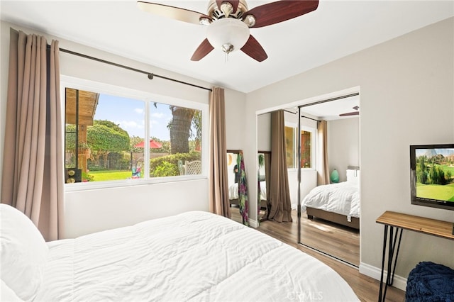 24311 Canyon Lake Dr N Unit 12, Canyon Lake, CA 92587 - bedroom with wood finished floors, a closet, a ceiling fan, and baseboards