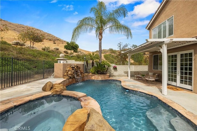 25605 Wordsworth Ln, Stevenson Ranch, CA 91381 - view of pool featuring a mountain view, a patio, a fenced backyard, and a pool with connected hot tub