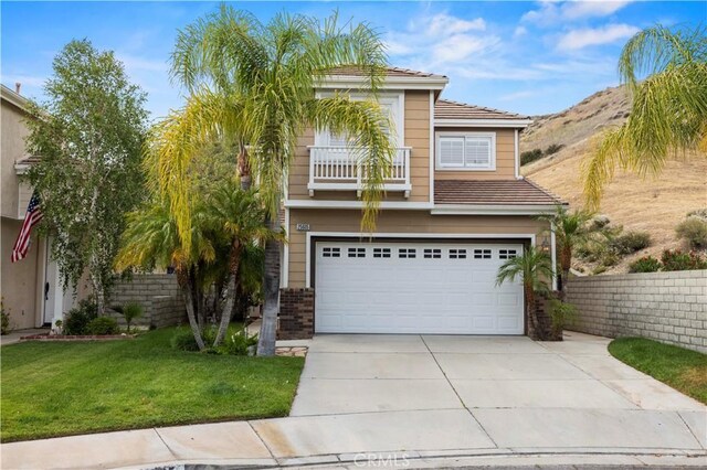 25605 Wordsworth Ln, Stevenson Ranch, CA 91381 - view of front of property with a garage, driveway, a front yard, and a tiled roof