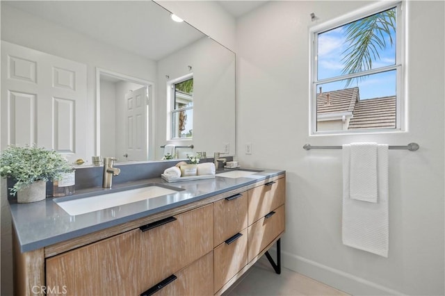 25605 Wordsworth Ln, Stevenson Ranch, CA 91381 - bathroom with double vanity and baseboards
