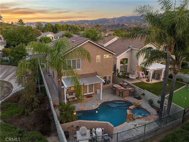 25605 Wordsworth Ln, Stevenson Ranch, CA 91381 - view of pool featuring a fenced backyard, a pergola, a mountain view, a patio area, and a pool with connected hot tub