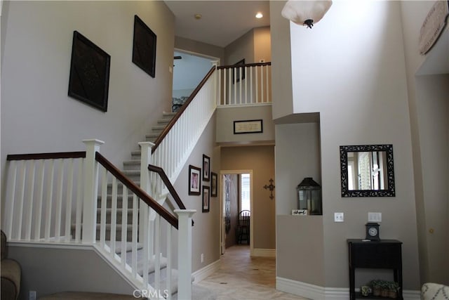 1338 Coral Gables Cir, Corona, CA 92881 - staircase featuring baseboards, recessed lighting, and a high ceiling