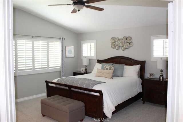 1338 Coral Gables Cir, Corona, CA 92881 - carpeted bedroom with multiple windows, vaulted ceiling, baseboards, and a ceiling fan