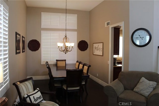 1338 Coral Gables Cir, Corona, CA 92881 - dining room featuring a chandelier, baseboards, and carpet