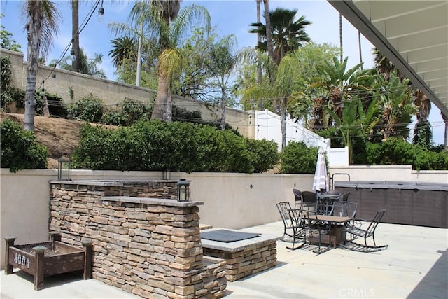 1338 Coral Gables Cir, Corona, CA 92881 - fenced backyard featuring a hot tub, a patio, and outdoor dining area