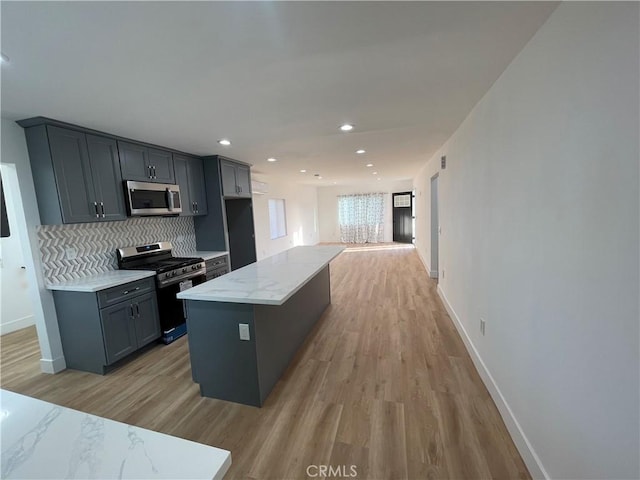11431 Lee Ln, El Monte, CA 91731 - kitchen featuring stainless steel appliances, baseboards, light wood-style floors, tasteful backsplash, and recessed lighting