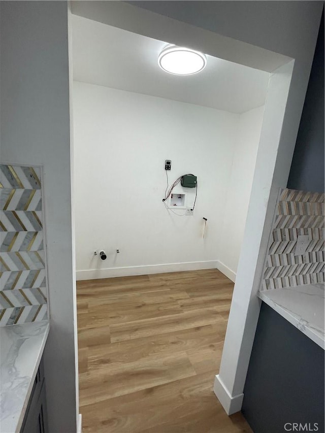 11431 Lee Ln, El Monte, CA 91731 - washroom with light wood-type flooring and baseboards