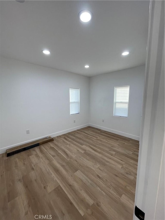 11431 Lee Ln, El Monte, CA 91731 - spare room with healthy amount of natural light, wood finished floors, recessed lighting, and baseboards