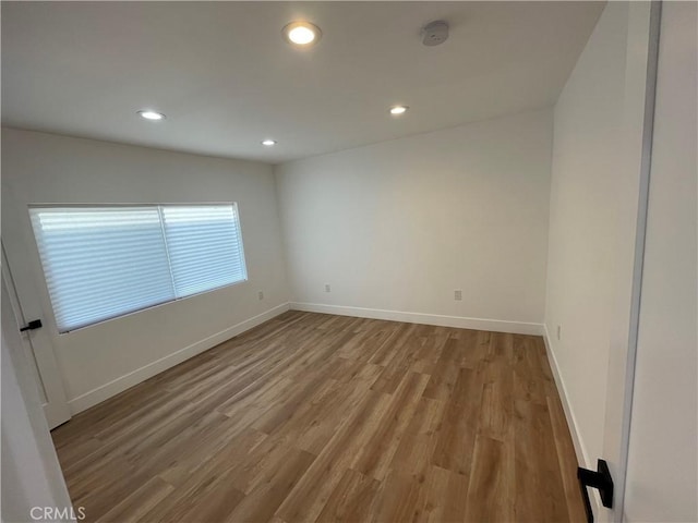 11431 Lee Ln, El Monte, CA 91731 - unfurnished room featuring wood finished floors, recessed lighting, a smoke detector, and baseboards