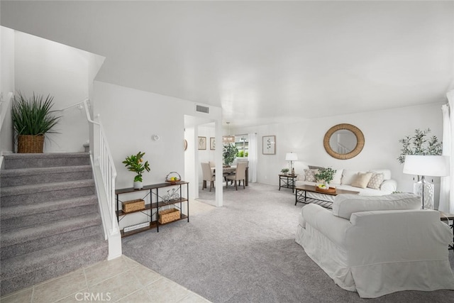 4057 Via Encinas, Cypress, CA 90630 - living room featuring stairway, light carpet, and light tile patterned flooring