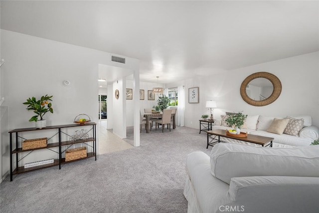 4057 Via Encinas, Cypress, CA 90630 - living room featuring light carpet and a chandelier