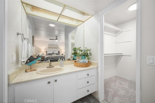 4057 Via Encinas, Cypress, CA 90630 - ensuite bathroom with vanity, a ceiling fan, and a spacious closet