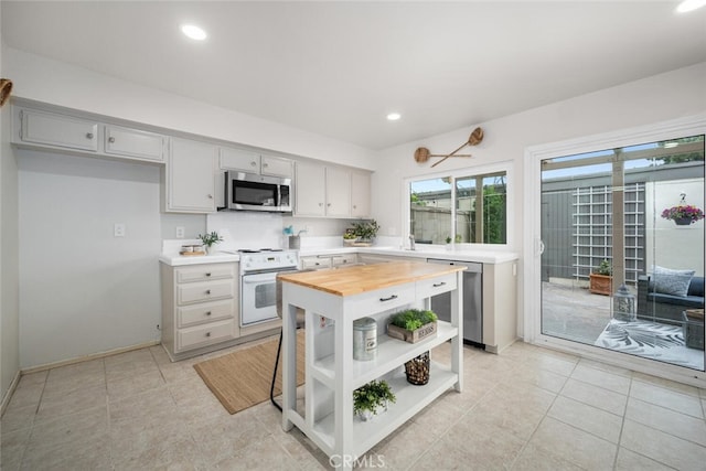 4057 Via Encinas, Cypress, CA 90630 - kitchen featuring stainless steel appliances, butcher block counters, open shelves, and recessed lighting