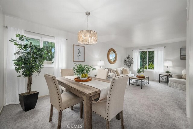 4057 Via Encinas, Cypress, CA 90630 - carpeted dining space with plenty of natural light and a chandelier