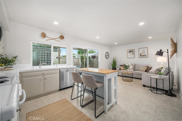 4057 Via Encinas, Cypress, CA 90630 - kitchen featuring stainless steel dishwasher, stove, recessed lighting, wooden counters, and light tile patterned floors