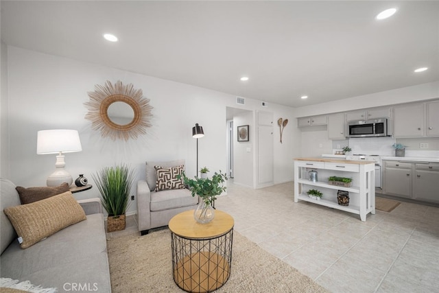 4057 Via Encinas, Cypress, CA 90630 - living area featuring recessed lighting and light tile patterned floors