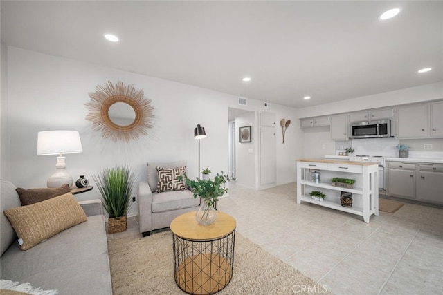 4057 Via Encinas, Cypress, CA 90630 - living area featuring recessed lighting and light tile patterned flooring