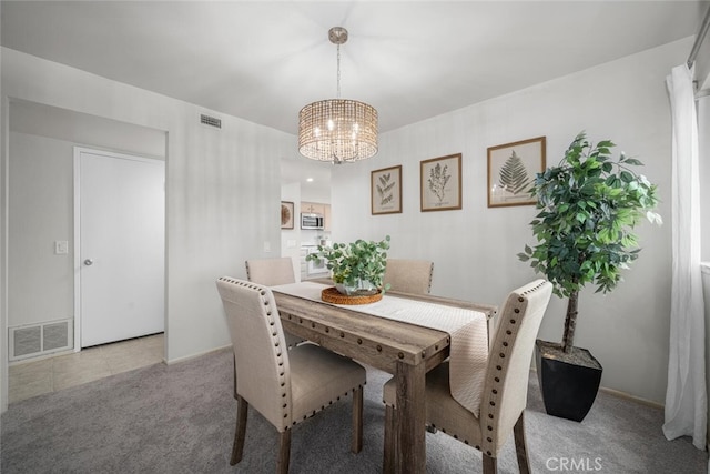 4057 Via Encinas, Cypress, CA 90630 - carpeted dining space with a chandelier and baseboards