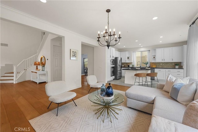 1641 Via Tulipan, San Clemente, CA 92673 - living area featuring a chandelier, stairway, light wood-style floors, recessed lighting, and baseboards