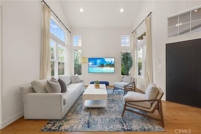 1641 Via Tulipan, San Clemente, CA 92673 - living area with high vaulted ceiling, baseboards, wood finished floors, and recessed lighting