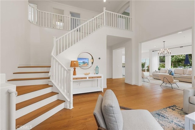 1641 Via Tulipan, San Clemente, CA 92673 - staircase with a chandelier, wood finished floors, a towering ceiling, and baseboards