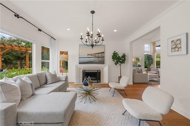 1641 Via Tulipan, San Clemente, CA 92673 - living area with ornamental molding, a chandelier, light wood-type flooring, recessed lighting, and a fireplace