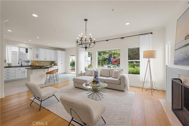 1641 Via Tulipan, San Clemente, CA 92673 - living area featuring light wood-type flooring, a chandelier, recessed lighting, and baseboards