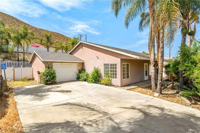 29582 Toomas Cir, Menifee, CA 92587 - view of front facade featuring stucco siding, an attached garage, and concrete driveway