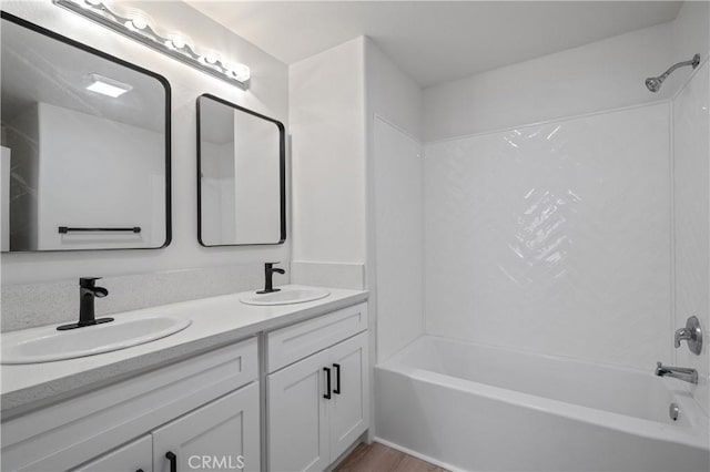 29582 Toomas Cir, Menifee, CA 92587 - bathroom featuring shower / washtub combination, double vanity, and wood finished floors