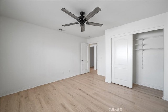 29582 Toomas Cir, Menifee, CA 92587 - unfurnished bedroom with light wood-type flooring, a closet, baseboards, and ceiling fan