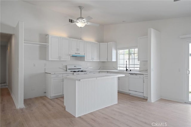 29582 Toomas Cir, Menifee, CA 92587 - kitchen featuring white appliances, under cabinet range hood, a sink, ceiling fan, and high vaulted ceiling