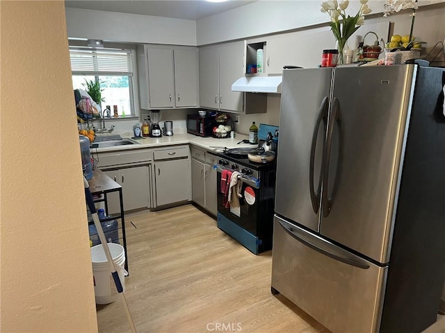 1881 Mitchell, Atwater, CA 95301 - kitchen with freestanding refrigerator, stove, gray cabinetry, light wood-style flooring, and light countertops