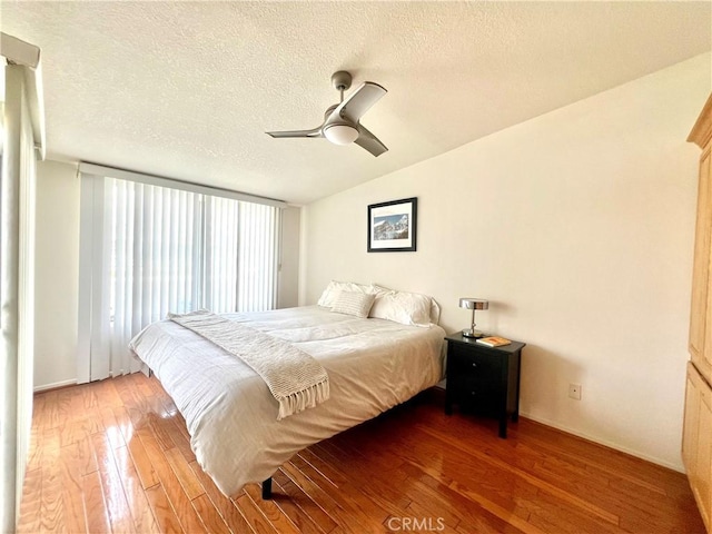 13721 El Dorado Dr Unit M3-K, Seal Beach, CA 90740 - bedroom featuring wood-type flooring, a textured ceiling, a ceiling fan, and lofted ceiling