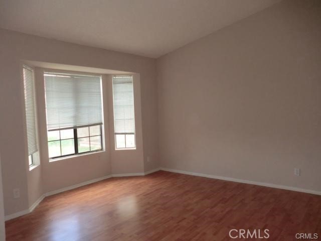 37901 Rosemarie St, Palmdale, CA 93550 - empty room featuring wood finished floors and baseboards